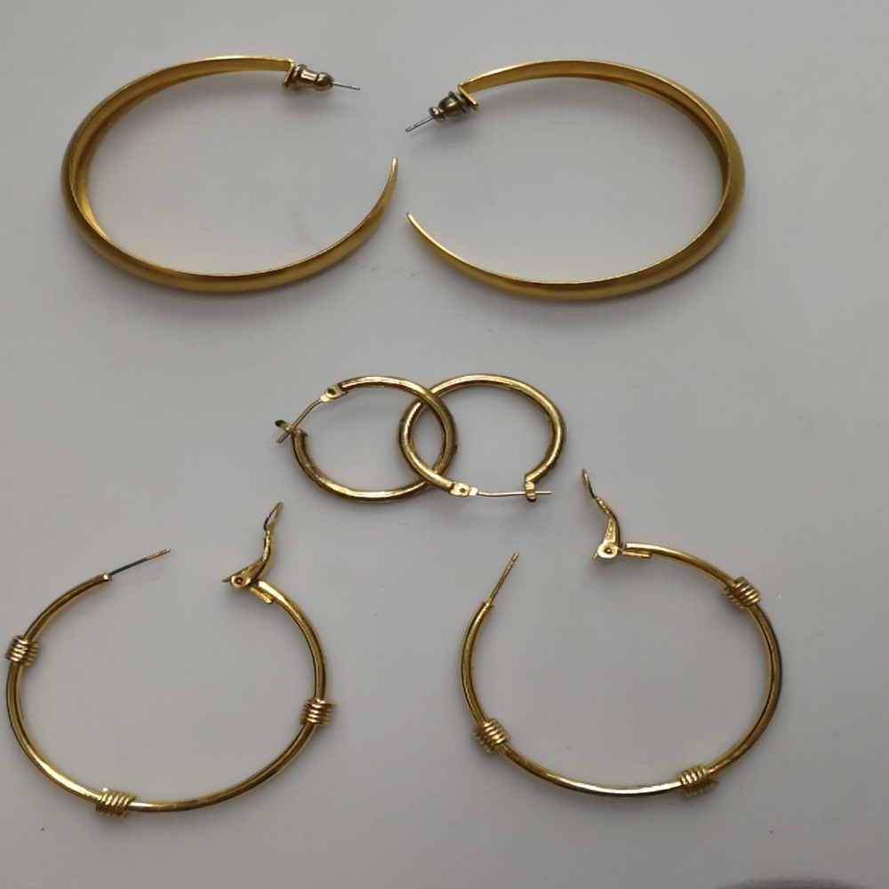 3 pairs of golden tone earrings